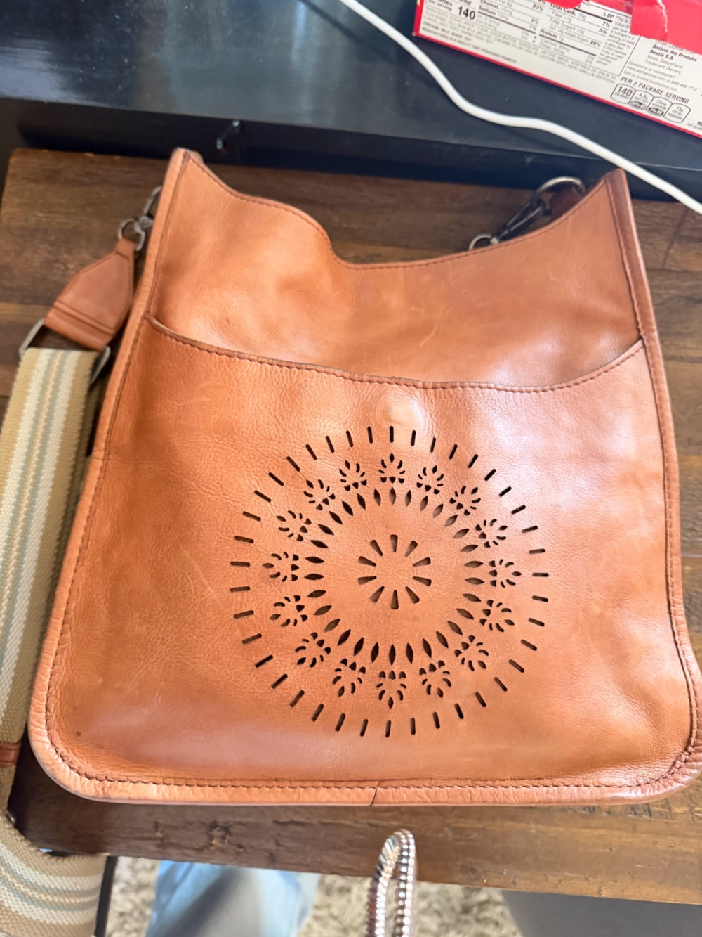 Classic Tan Leather Shoulder Bag with Laser-Cut Medallion